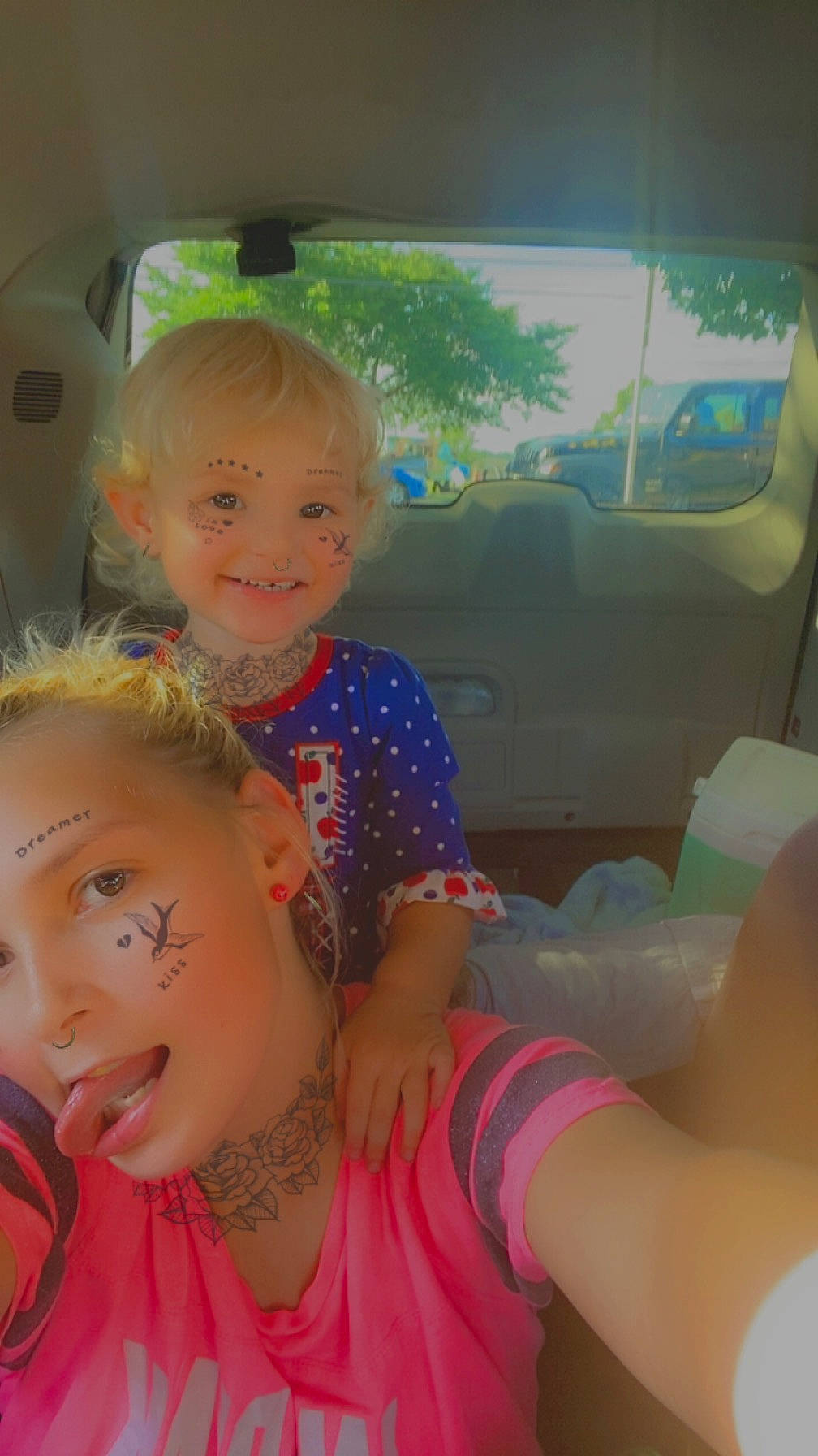 Caroline is registered to the contest to win money with this photo: automotive_exterior, automotive_window_part, blond, car, car_seat, event, family_car, fun, happy, human_leg, leisure, motor_vehicle, mouth, person, skin, smile, summer, t_shirt, toddler, vehicle_door