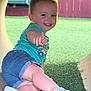 toddler, child, smiling, outdoor, grass, playground, tunnel, shorts, shirt, sandals, pigtails, happy, cute, summer, play, fun, young_child, casual_clothing, daylight, portrait