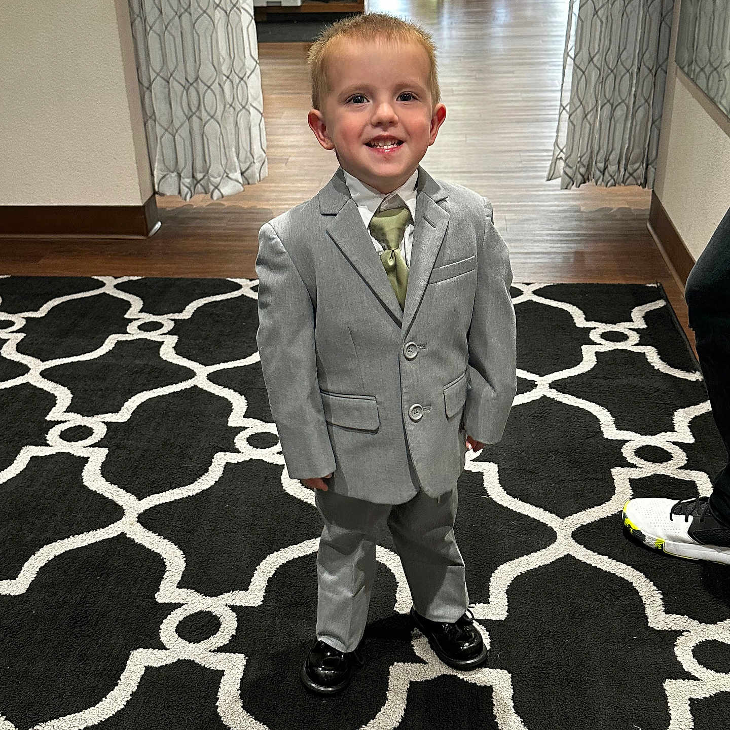 Peyton is registered to the contest to win money with this photo: accessories, blazer, boy, child, clothing, coat, face, footwear, formalwear, head, homedecor, jacket, male, pants, person, photography, portrait, shoe, suit, tie