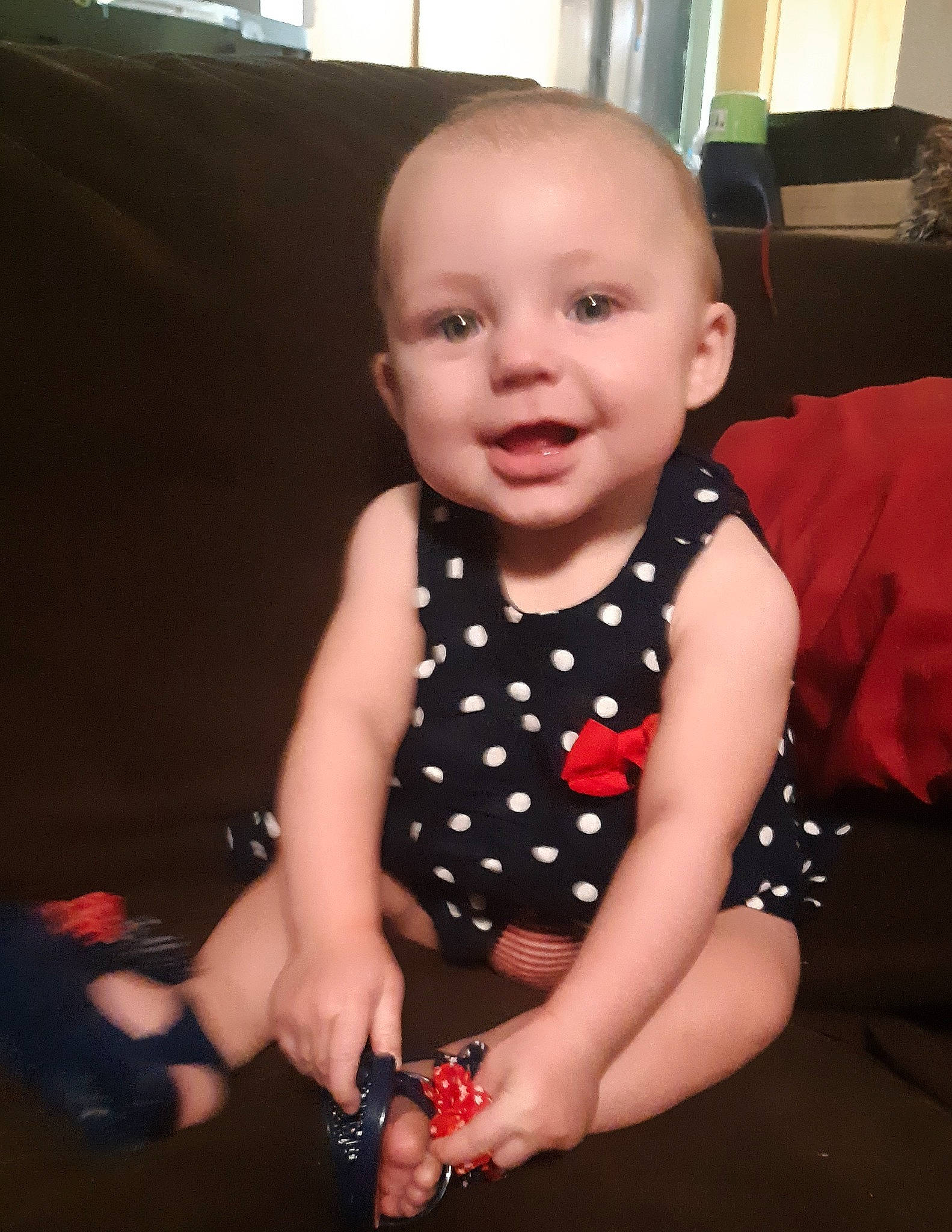 Kimberlynn is registered to the contest to win money with this photo: baby, baby_products, baby_toddler_clothing, cheek, child, design, dress, eye, finger, head, iris, joy, leg, lip, mouth, pattern, person, polka_dot, product, sitting