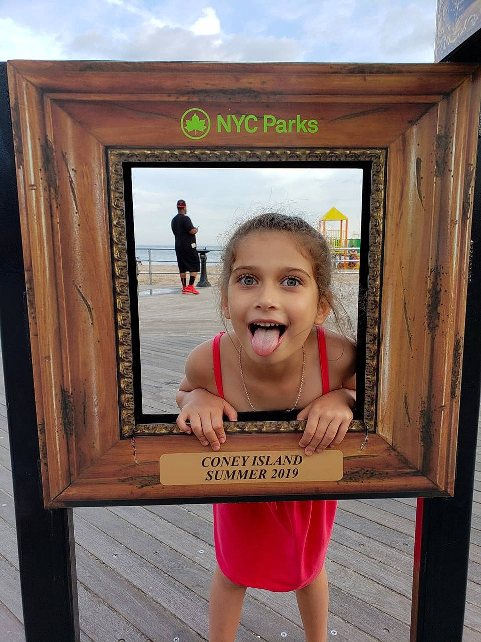 Alexandra is registered to the contest to win money with this photo: child, cloud, fun, happy, hardwood, joy, leisure, person, recreation, rectangle, room, shorts, sky, smile, standing, t_shirt, toddler, travel, tree, vacation