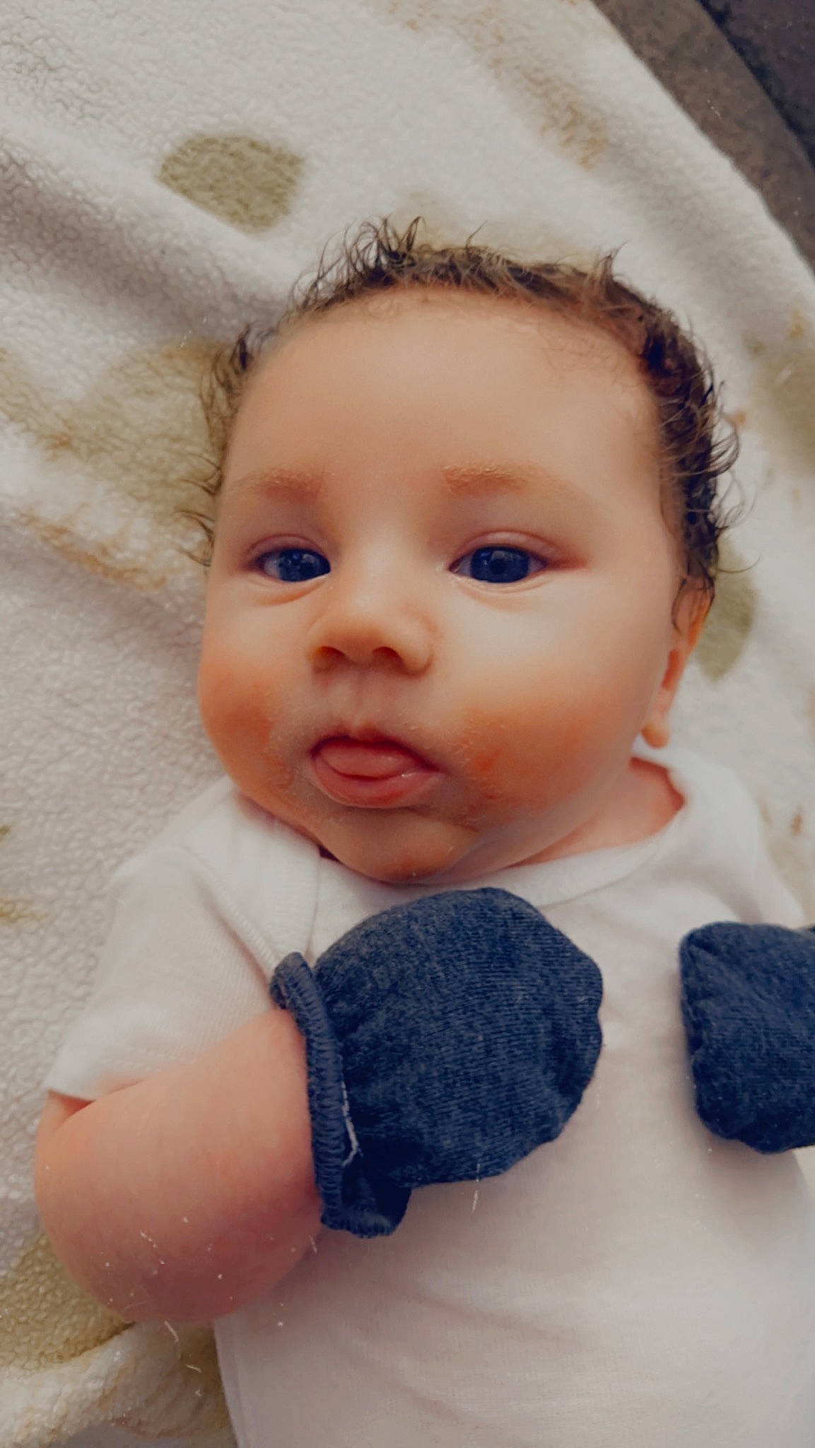 Reed is registered to the contest to win money with this photo: baby, baby_toddler_clothing, cheek, child, close_up, eye, eyebrow, eyelash, fashion_accessory, happy, headgear, iris, linens, lip, nose, pattern, person, skin, sleeve, toddler
