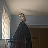 animal, cage, cat, coat, collar, curiosity, curtains, domestic, furniture, hanging_clothes, indoor, looking_out, pet, quiet, room, shadow, soft_light, still_life, tabby_cat, window
