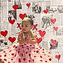 toddler, child, dress, pink, hearts, clapping, baby, wallpaper, newspaper, graffiti, red_hearts, black_and_white, vintage_photos, indoor, cute, smiling, bow, portrait, artistic_background, happy
