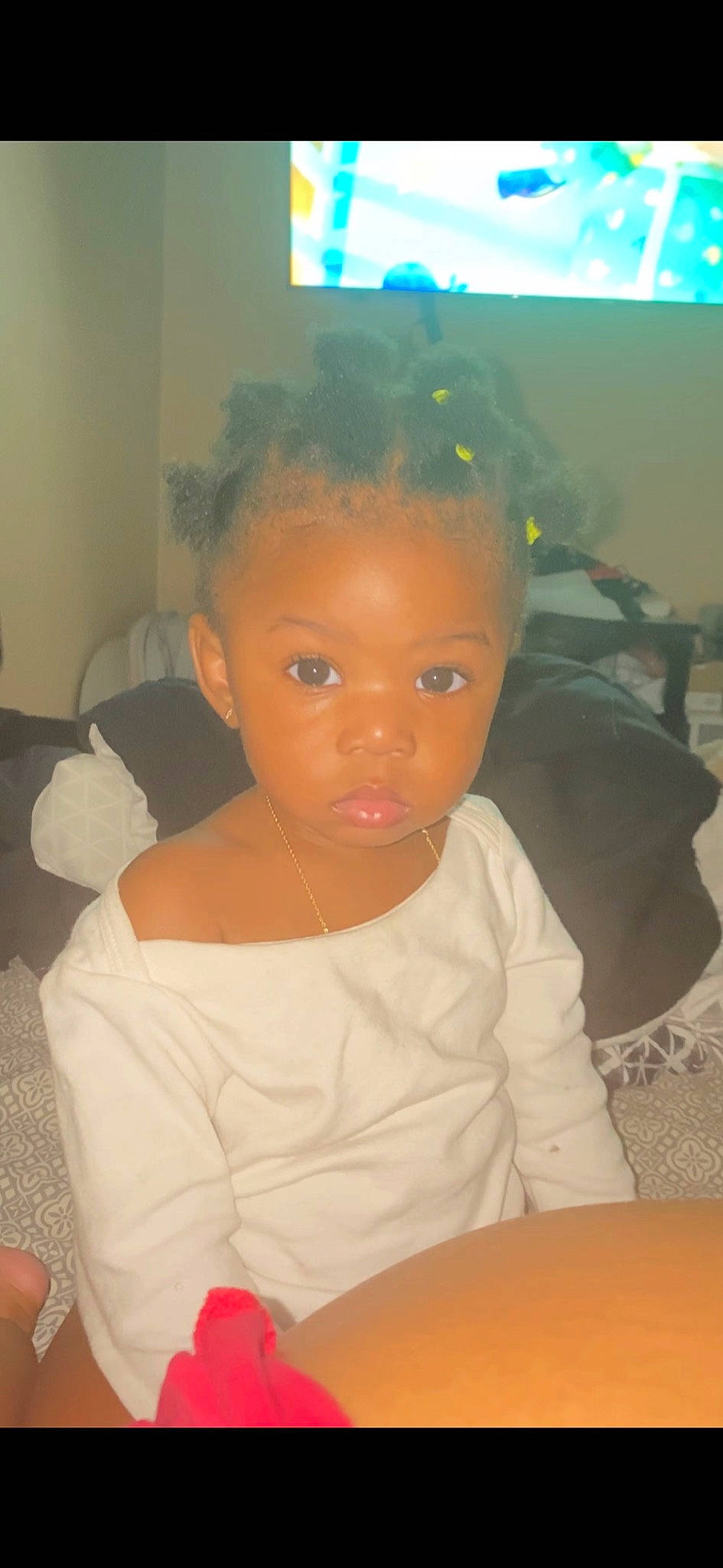 Riley is registered to the contest to win money with this photo: baby_toddler_clothing, black_hair, chair, cheek, chest, child, ear, event, eyebrow, eyelash, forehead, fun, happy, iris, lip, nose, person, room, sitting, table