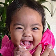 Dreamy joined the competition — help win amazing prizes! baby, child, smiling, happy, pink_clothing, hand, face, holding_hand, indoor, plant, person, cute, joyful, infant, skin, portrait, closeup, expression, support, human