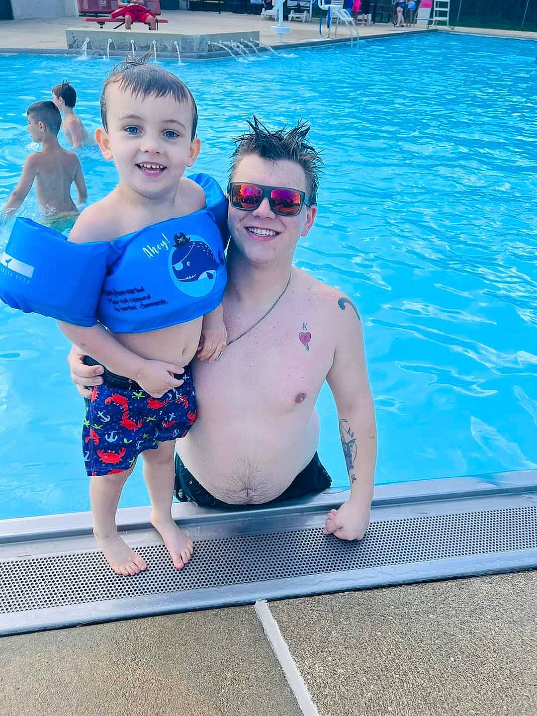 Khyri is registered to the contest to win money with this photo: aqua, azure, blue, chest, event, eyewear, fun, goggles, happy, joy, leisure, person, personal_protective_equipment, recreation, smile, summer, sunglasses, swimming_pool, swimwear, thigh