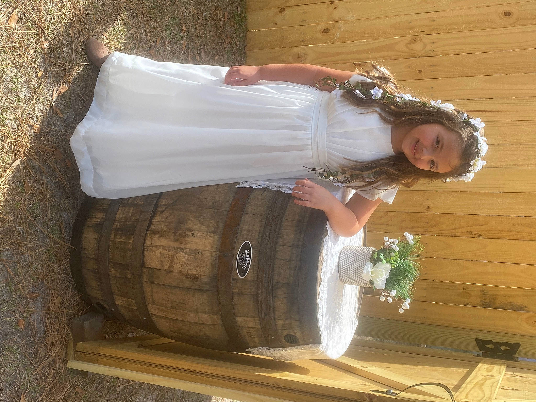 Alivia is registered to the contest to win money with this photo: barrel, bridal_accessory, bridal_clothing, bridal_party_dress, bridal_veil, bride, dress, event, flash_photography, formal_wear, gown, happy, joy, long_hair, person, plant, smile, tire, veil, waist