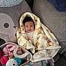 Ava joined the competition — help win amazing prizes! baby, blanket, smile, face, toy, plush_toy, couch, pillow, child, indoor, cozy, winnie_the_pooh, stuffed_animal, happy, comfort, soft, infant, wrapped, cute, colorful