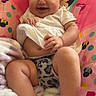 Oakley is registered to the contest to win money with this photo: baby, child, infant, smiling, happy, portrait, sitting, headband, bow, dress, blanket, chair, minnie_mouse, pink, polka_dots, indoor, face, barefoot, cuddly, photography