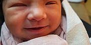 Layla Rose joined the competition — help win amazing prizes! newborn, baby, smiling, close_up, blanket, pink, wrapped, infant, face, skin, happy, cute, soft, sleepy, cozy, child, portrait, indoors, newborn_clothing, head