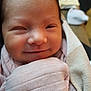 Layla Rose joined the competition — help win amazing prizes! baby, newborn, smile, wrapped, blanket, closeup, face, infant, soft, cozy, cute, skin, head, young, child, sleepy, warm, indoors, person, portrait