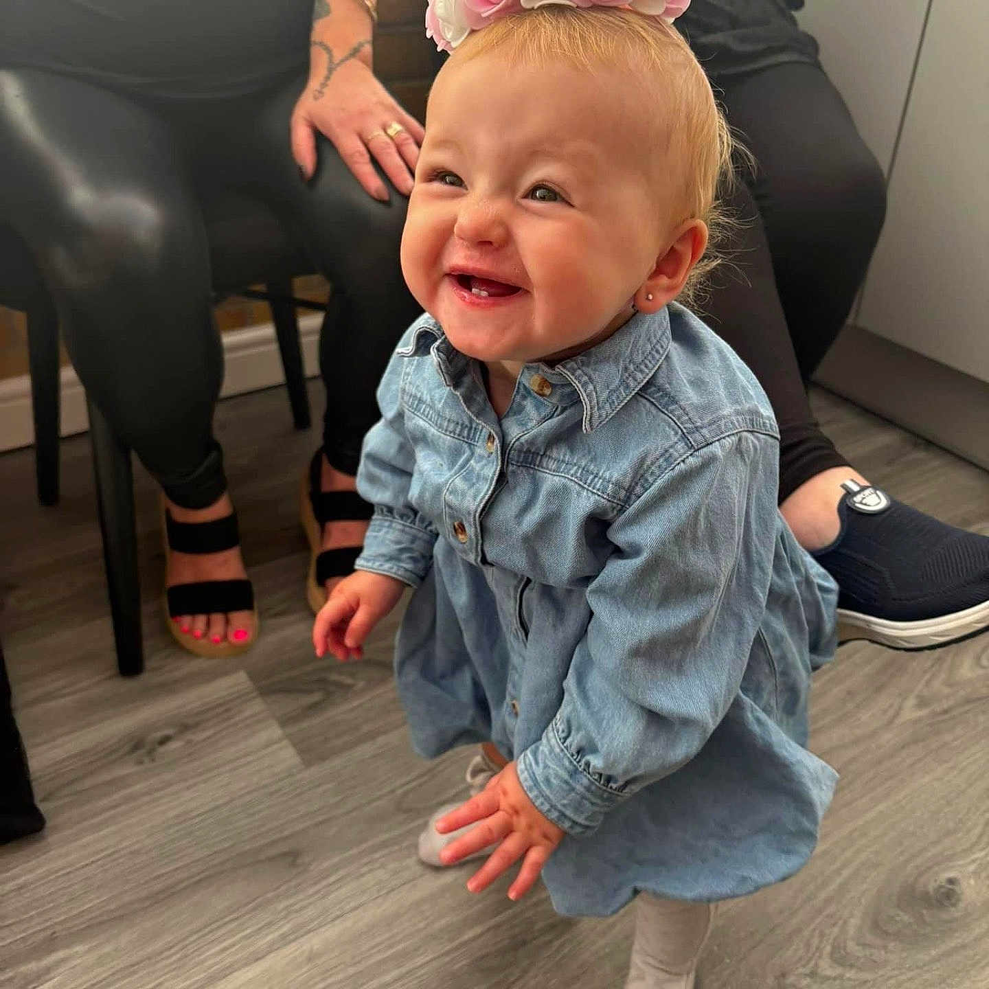 Arabella joined the competition — help win amazing prizes! adult, baby, babylaughing, clothing, coat, face, female, footwear, happy, head, hosiery, jeans, pants, person, photography, portrait, sandal, sitting, sock, woman