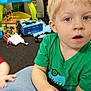 Killian is registered to the contest to win money with this photo: architecture, boy, building, child, clothing, couch, face, footwear, furniture, head, indoors, livingroom, male, person, photography, portrait, room, shoe, t_shirt, toy