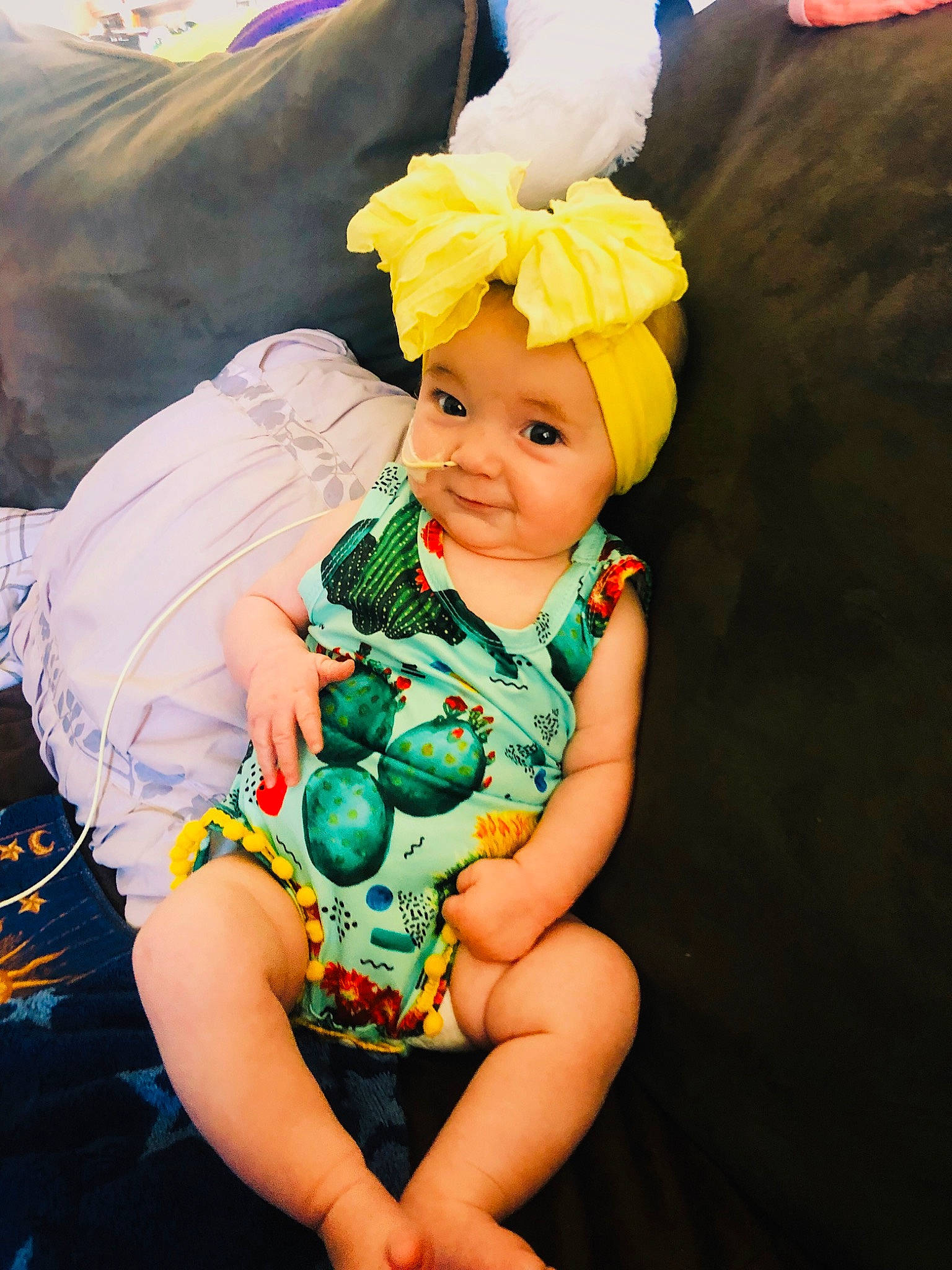 Bria is registered to the contest to win money with this photo: baby, baby_toddler_clothing, child, cool, costume_accessory, event, fashion_accessory, fun, grass, happy, headpiece, headwear, leisure, pattern, people_in_nature, person, petal, play, sitting, smile
