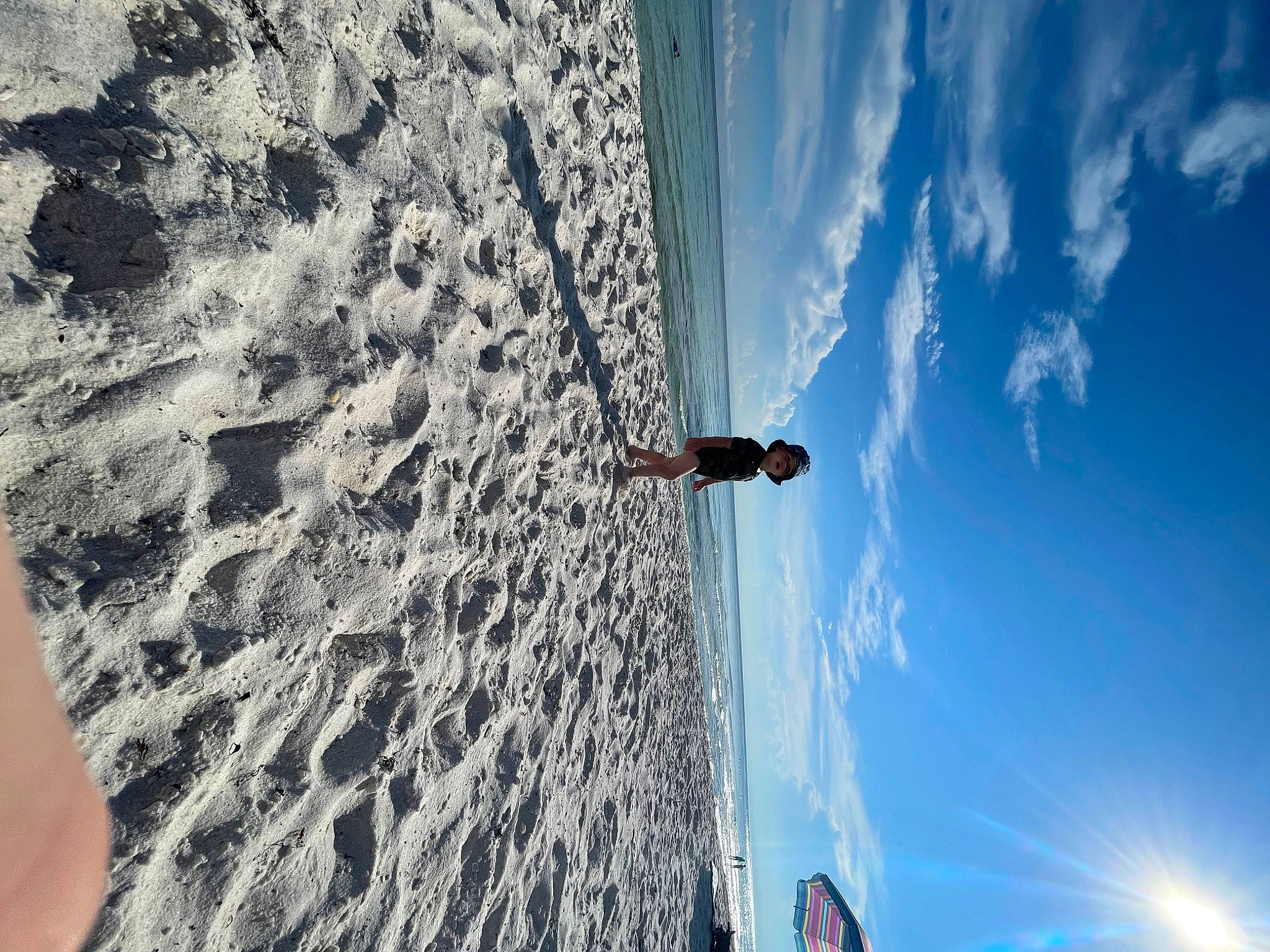 Bentley Lane joined the competition — help win amazing prizes! azure, beach, blue, cloud, electric_blue, formation, freezing, geological_phenomenon, headwear, landscape, leisure, light, person, plant, recreation, rock, shadow, sky, tints_and_shades, tree