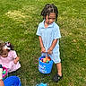 child, kids, easter_eggs, blue_bucket, pink_dress, grass, outdoor, spring, holiday, egghunt, playing, colorful, basket, toy, curly_hair, shorts, shoes, greenery, fun, daylight