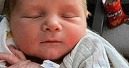 Luke joined the competition — help win amazing prizes! newborn, baby, sleeping, blanket, hospital_wristband, indoor, baby_clothing, face, infant, hand, furniture, chair, snack, doritos, relaxing, portrait, peaceful, resting, child, person