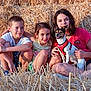 children, dog, hay, outdoor, summer, smiling, sitting, field, sunlight, casual_clothing, pet, happy, nature, playful, family, grass, animal, friendship, relaxing, fun