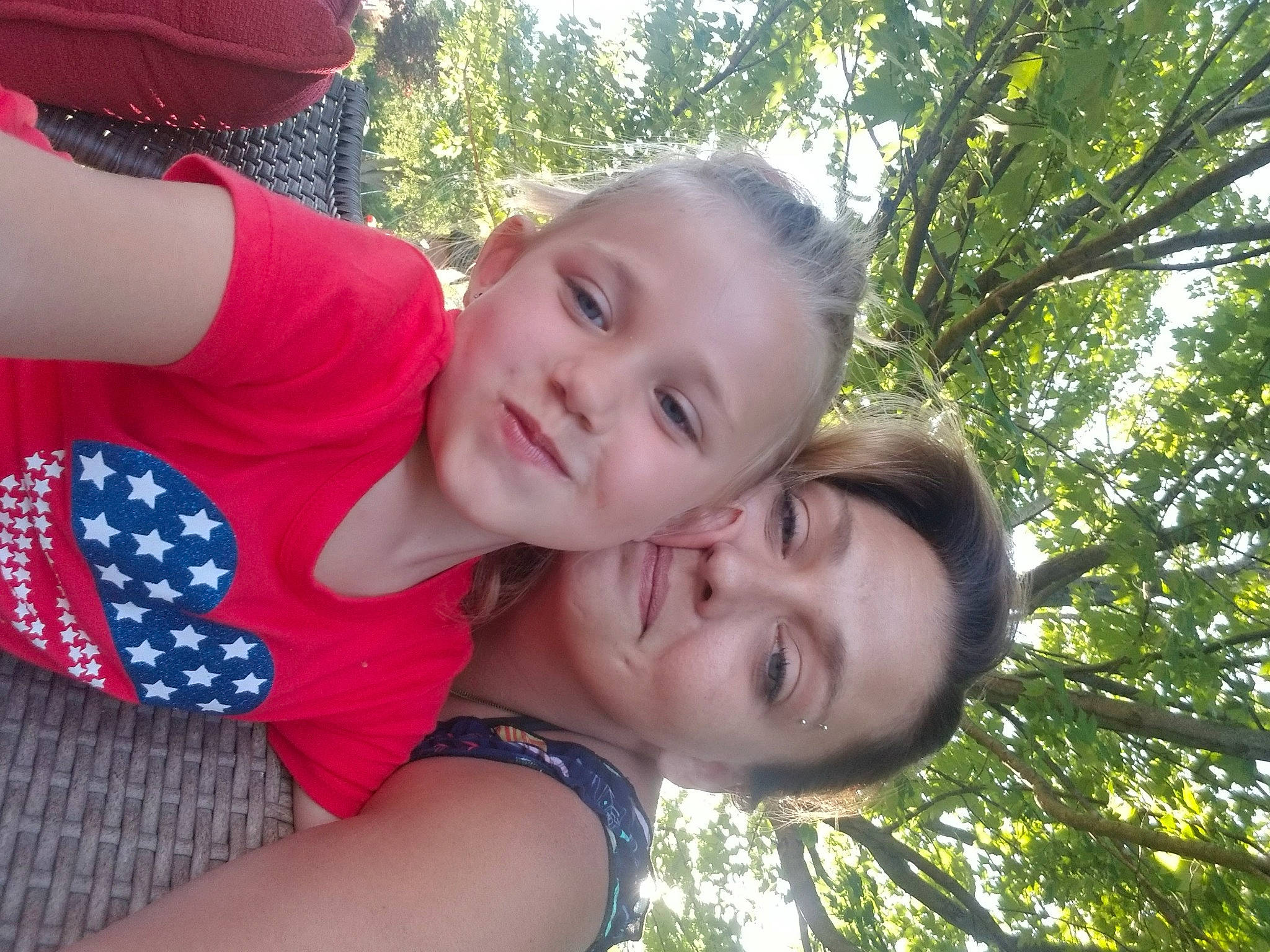 Allison is registered to the contest to win money with this photo: baseball_cap, cap, child, event, fun, gesture, grass, happy, hug, laugh, leisure, love, pattern, people_in_nature, person, recreation, smile, t_shirt, toddler, tree