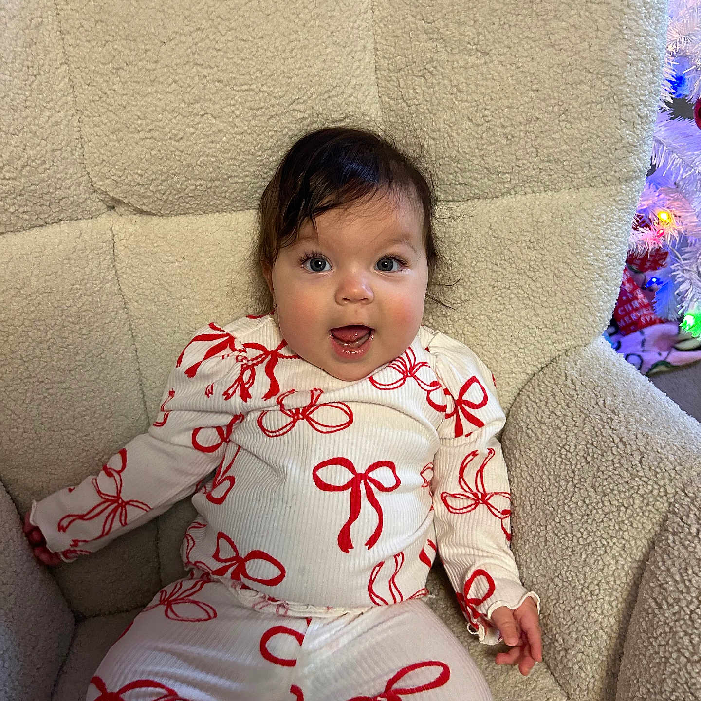 Mari is registered to the contest to win money with this photo: baby, bodypart, chair, clothing, couch, cushion, face, finger, furniture, hand, head, homedecor, longsleeve, pajamas, pants, person, photography, portrait, sitting, sleeve