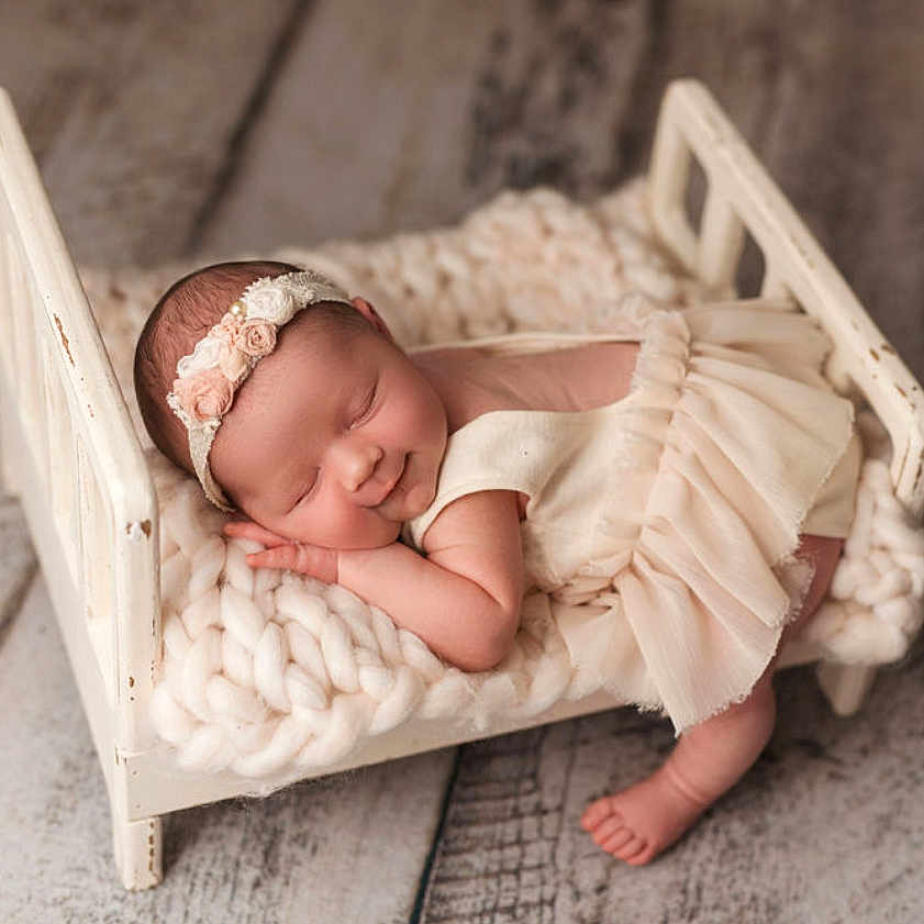 Vivian is registered to the contest to win money with this photo: baby, bed, blanket, cradle, crib, face, furniture, head, infantbed, newborn, person, sleeping