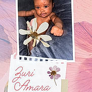 Zuri joined the competition — help win amazing prizes! baby, child, infant, portrait, smiling, sitting, flower, daisy, fist, scrapbook, pastel, pink, floral, name_card, handwritten_text, fabric, blanket, close_up, photography, safe