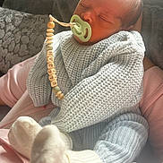 Elijah joined the competition — help win amazing prizes! baby, newborn, sleeping, pacifier, knitwear, socks, person, couch, cushion, hand, indoor, cozy, soft, child, infant, cute, rest, comfort, warm, peaceful