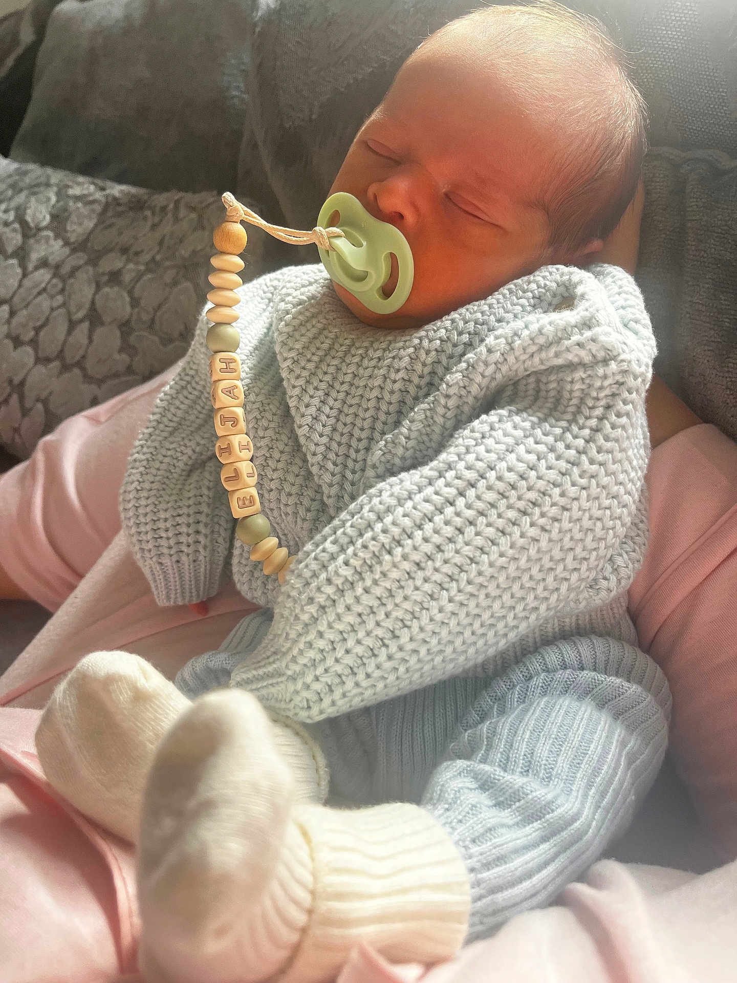 Elijah joined the competition — help win amazing prizes! baby, newborn, sleeping, pacifier, knitwear, socks, person, couch, cushion, hand, indoor, cozy, soft, child, infant, cute, rest, comfort, warm, peaceful