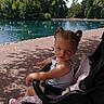toddler, child, stroller, pond, ducks, geese, water, trees, leaves, shade, sunlight, shadow, outdoor, park, path, nature, baby, summer, cute, casual