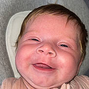 Nevaeh is registered to the contest to win money with this photo: baby, smiling, face, infant, pink_clothing, zipper, closeup, cheeks, skin, person, happy, head, hair, young_child, cute, indoors, apparel, fabric, babywear, portrait