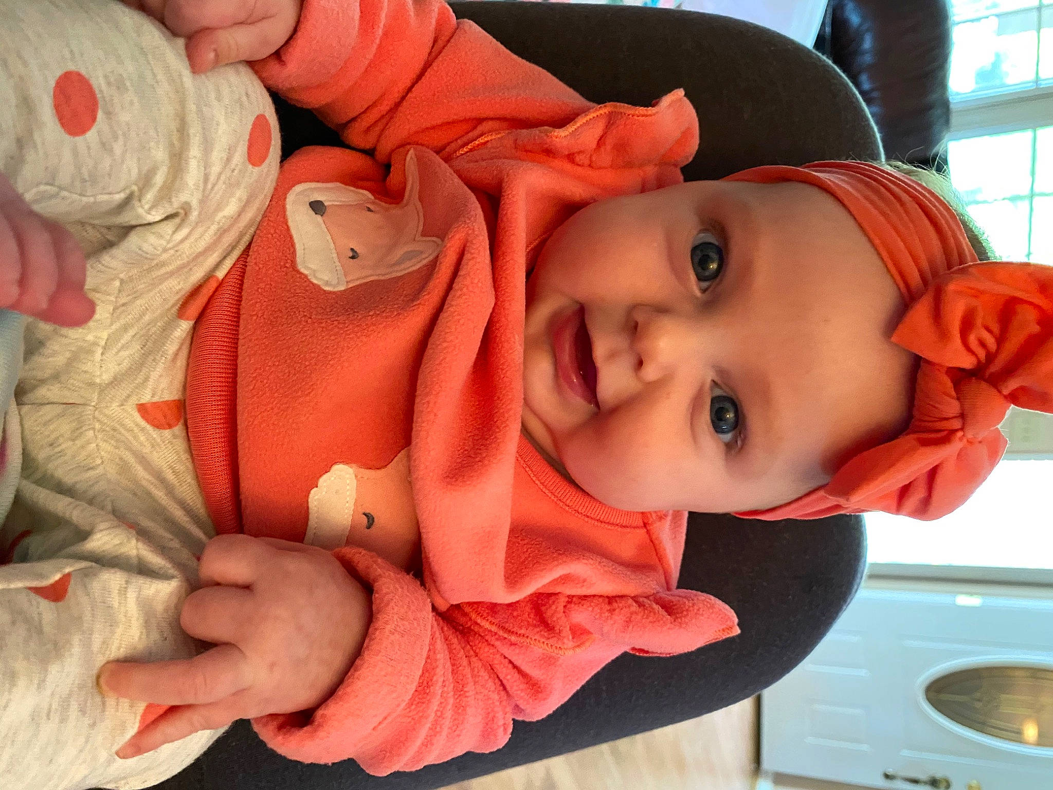 Ellyana is registered to the contest to win money with this photo: baby, cheek, child, ear, eye, face, finger, hand, head, headwear, mouth, nose, orange, person, skin, thumb, toddler