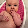 Maisie joined the competition — help win amazing prizes! baby, infant, bath, bathtub, pink, skin, wet, fingers, face, eyes, expression, child, cute, water, sitting, indoors, closeup, person, head, young