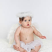 Leighton joined the competition — help win amazing prizes! baby, angel, wings, halo, white, tutu, necklace, bare_chest, sitting, soft_rug, blue_eyes, cute, innocent, portrait, child, costume, feathers, adorable, expression, toddler