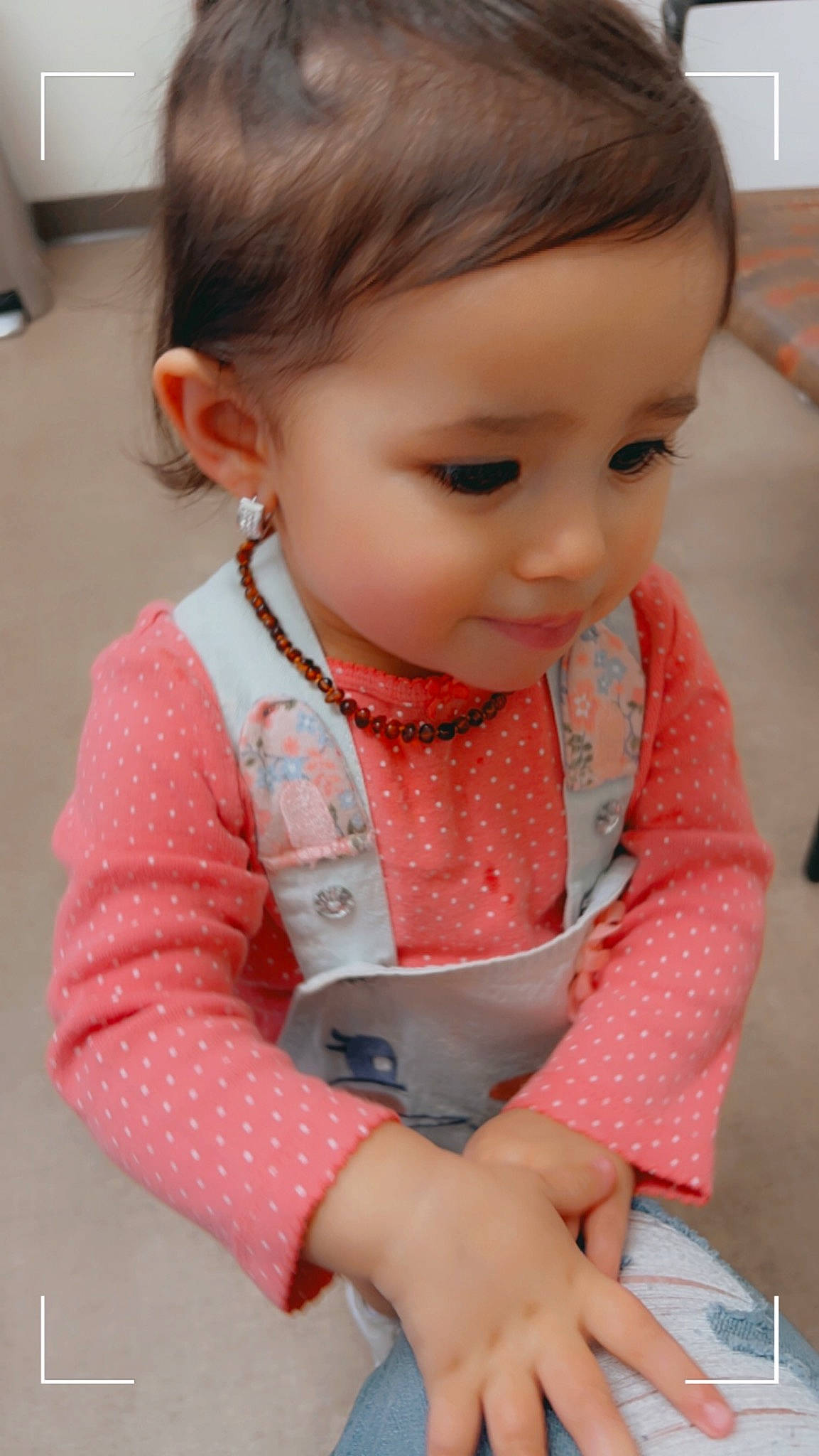 Emberlynn joined the competition — help win amazing prizes! baby, baby_toddler_clothing, brown_hair, cheek, child, chin, eyelash, fashion_accessory, flooring, hair, head, neck, nose, pattern, person, sitting, skin, sleeve, t_shirt, toddler