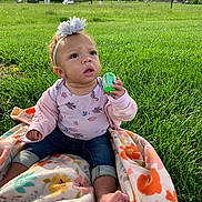 Jade is registered to the contest to win money with this photo: architecture, baby, building, clothing, face, field, grass, grassland, head, lawn, nature, outdoors, pants, park, person, photography, plant, portrait, shelter, summer