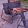 Aïko participe au concours pour gagner de l'argent avec cette photo : backyard, blue_collar, chair, collar, dog, funny_pose, furniture, garden, german_shepherd, gravel, large_dog, lounge, lying_down, outdoor, patio, paving_stones, pet, potted_plants, relaxed, resting