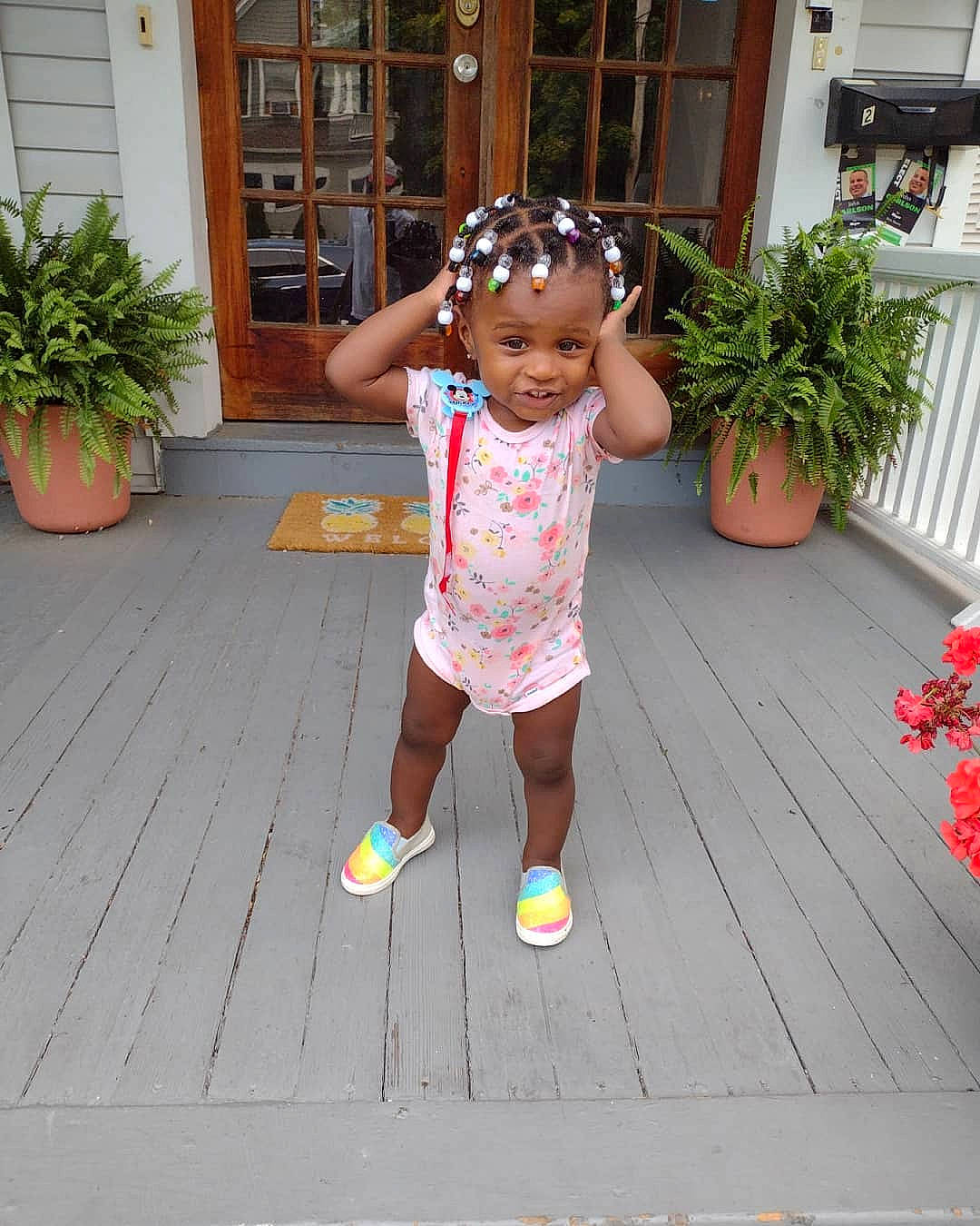 Korryn is registered to the contest to win money with this photo: baby_toddler_clothing, building, child, deck, flooring, flower, flowerpot, fun, garden, grass, hardwood, hat, headwear, home, houseplant, leisure, person, plant, smile, t_shirt