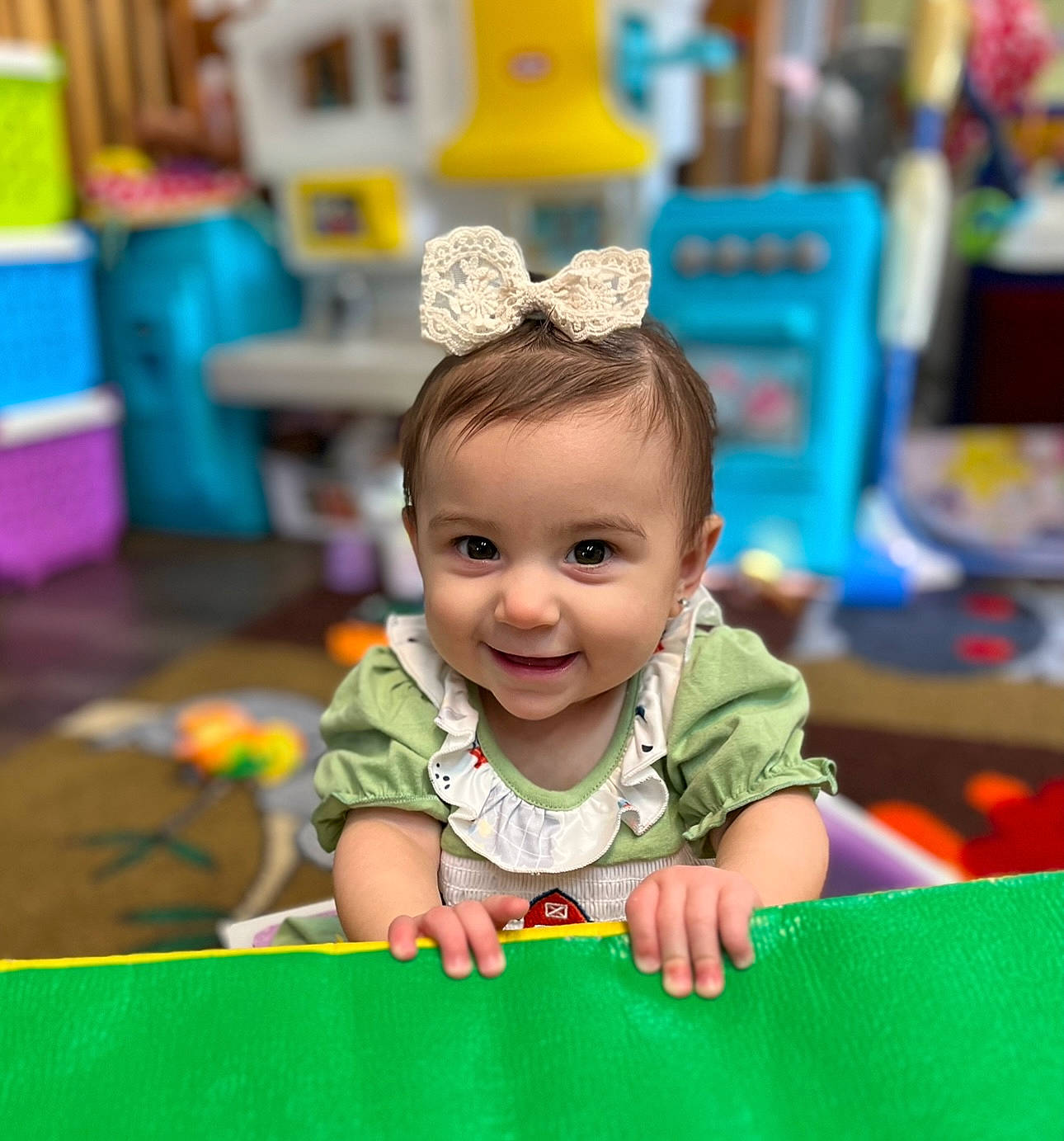 Emelia is registered to the contest to win money with this photo: baby, baby_playing_with_toys, blue, child, event, eye, facial_expression, fun, green, happy, joy, kindergarten, leisure, person, photograph, recreation, sitting, skin, smile, snapshot