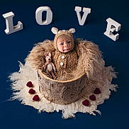 Kaizen joined the competition — help win amazing prizes! baby, infant, costume, bear_outfit, wooden_bucket, fluffy_wool, red_hearts, love_letters, blue_background, soft_texture, cute, portrait, newborn, stuffed_toy, knitted, warm, adorable, studio_photo, smiling, child