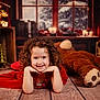 books, child, clock, cozy_room, curly_hair, cute, decor, girl, holiday, indoor, portrait, red_dress, resting, smile, snow, teddy_bear, vintage, warm_lighting, window, wooden_floor