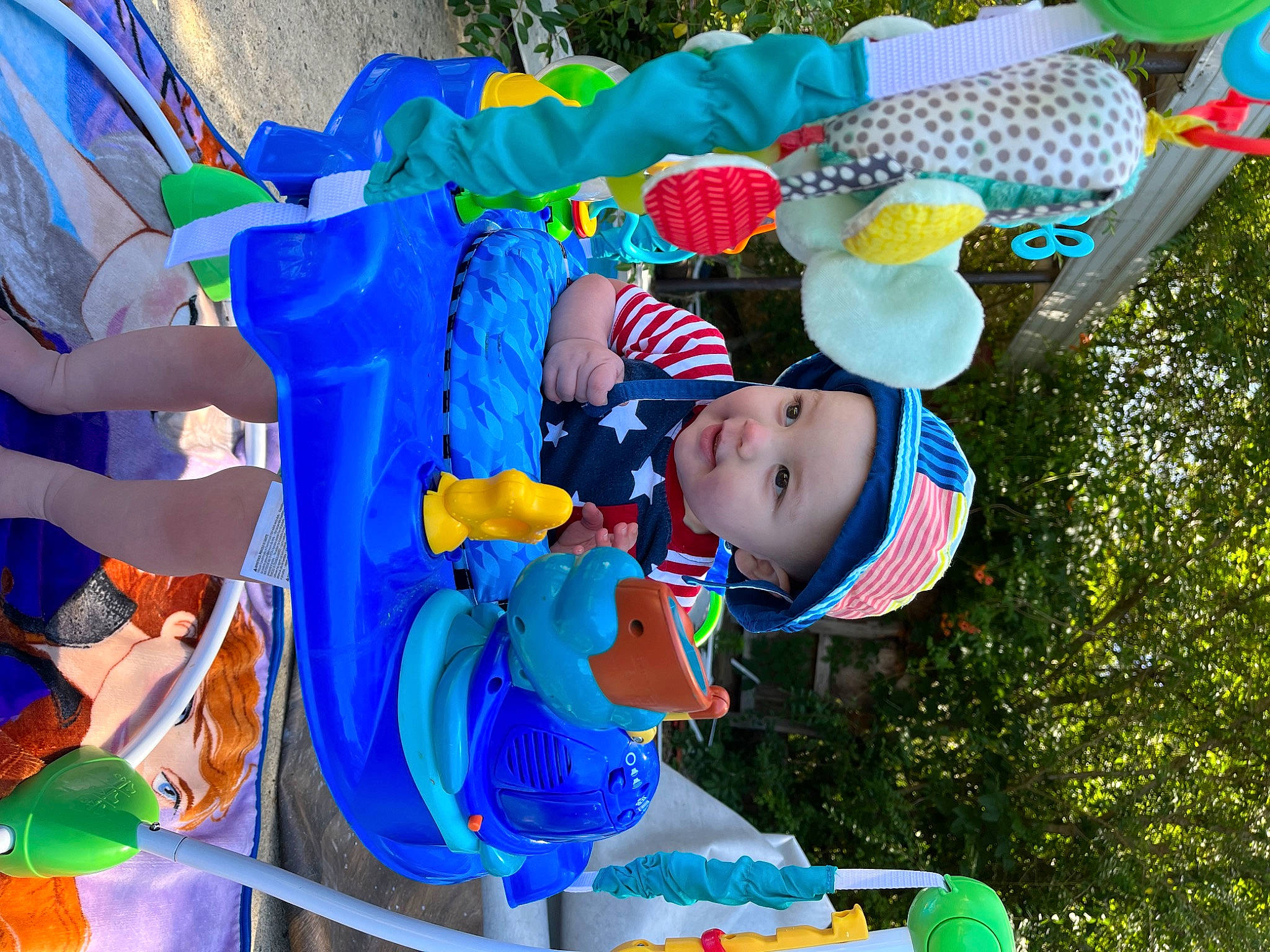Langston is registered to the contest to win money with this photo: baby, baby_toddler_clothing, blue, child, event, fun, green, happy, hat, headwear, leisure, people, person, photograph, play, public_space, recreation, smile, summer, toddler