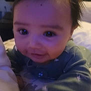 Ian joined the competition — help win amazing prizes! baby, child, infant, face, eyes, hair, bed, blanket, clothing, cute, expression, indoors, portrait, toddler, young, smiling, soft_light, pattern, sleepwear, cozy