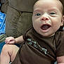 Jace joined the competition — help win amazing prizes! baby, blanket, child, clothing, couch, cute, expression, eyes, face, furniture, hand, head, indoor, infant, leg, mouth, onesie, person, portrait, skin