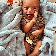John Luke joined the competition — help win amazing prizes! baby, infant, smile, blanket, pacifier, striped_clothing, hand, foot, cozy, cute, wrapped, soft_texture, happy, child, portrait, newborn, lying_down, warm_colors, face, skin