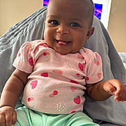 Jenesis joined the competition — help win amazing prizes! baby, child, smiling, tongue_out, pink_shirt, fruit_pattern, strawberries, cherries, mint_green_pants, sitting, indoor, happy, cute, infant, closeup, person, playful, clothing, portrait, cozy