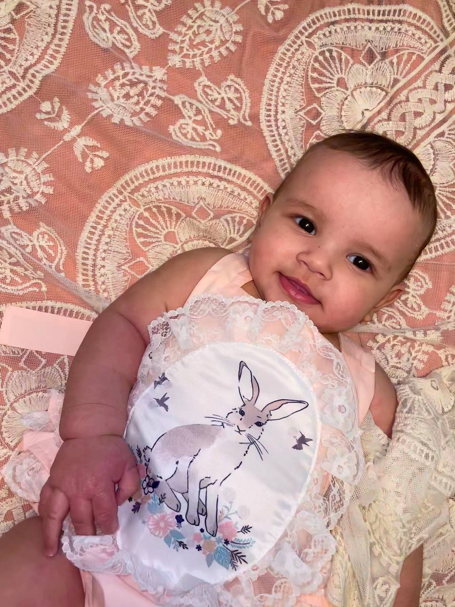 Kyla is registered to the contest to win money with this photo: baby, baby_toddler_clothing, cheek, child, day_dress, dress, embellishment, eyelash, fashion_accessory, happy, headpiece, iris, linens, pattern, person, pink, product, skin, sleeve, textile