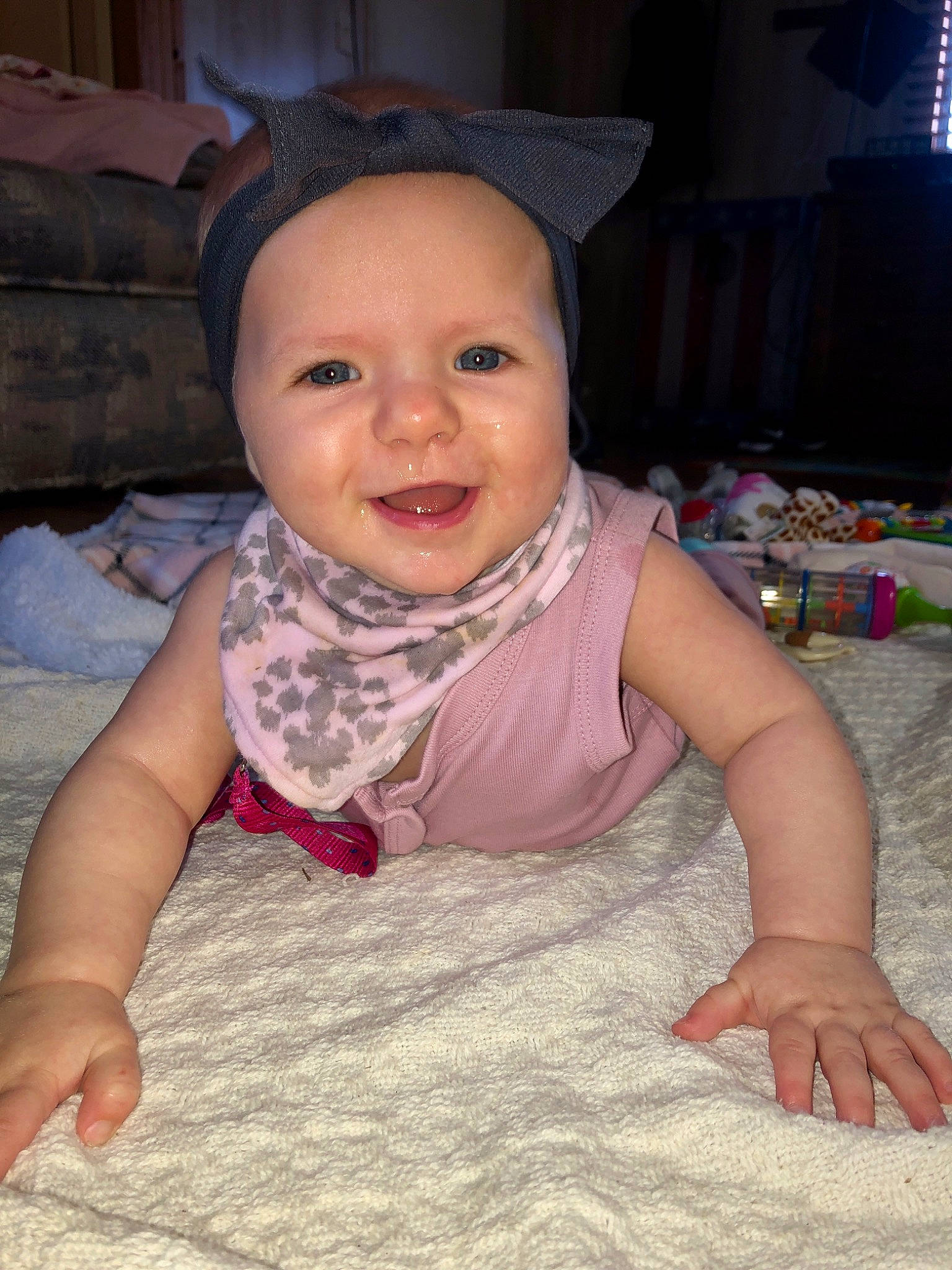 Jocelynn is registered to the contest to win money with this photo: baby, baby_toddler_clothing, cheek, child, crawling, eye, face, head, headgear, headwear, iris, joy, lip, person, pink, sitting, skin, smile, toddler