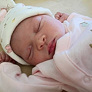 Ty'Arre joined the competition — help win amazing prizes! baby, sleeping, infant, hat, pink_clothing, cozy, cute, peaceful, resting, newborn, soft, pastel, hand, face, closed_eyes, portrait, indoors, comfort, warm, adorable