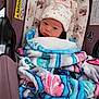 Ty'Arre joined the competition — help win amazing prizes! newborn, baby, blanket, car_seat, hat, floral_pattern, face, person, child, infant, cute, bundle, safety_label, seated, warm, indoors, clothing, expression, closeup, portrait